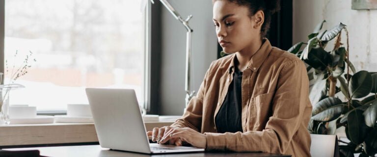 A woman working on a laptop