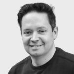 Black and white headshot of NomuPay Board Advisor, Juan Benitez