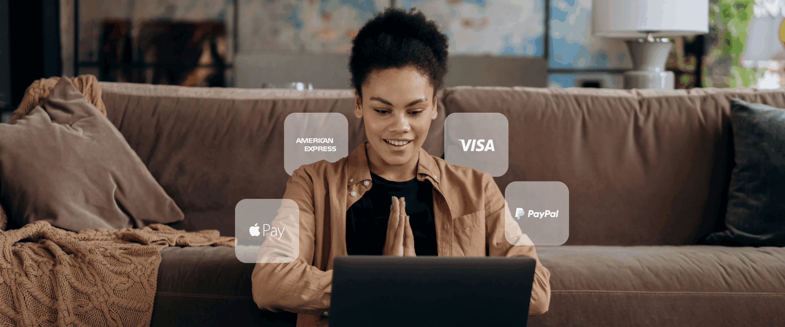 A woman on her laptop with different APM logos floating around her
